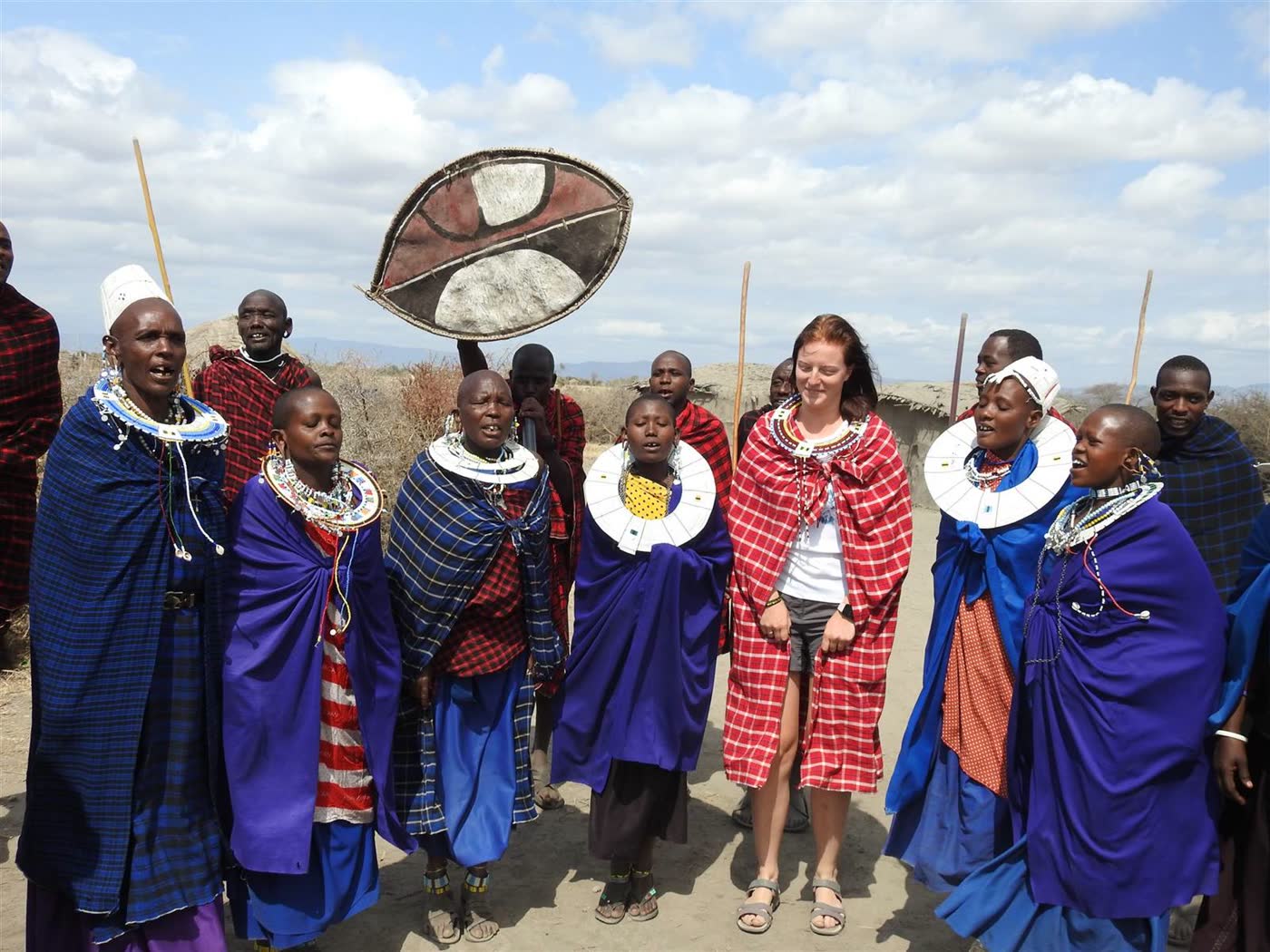 Tourist joining a Maasai cultural ceremony in Tanzania