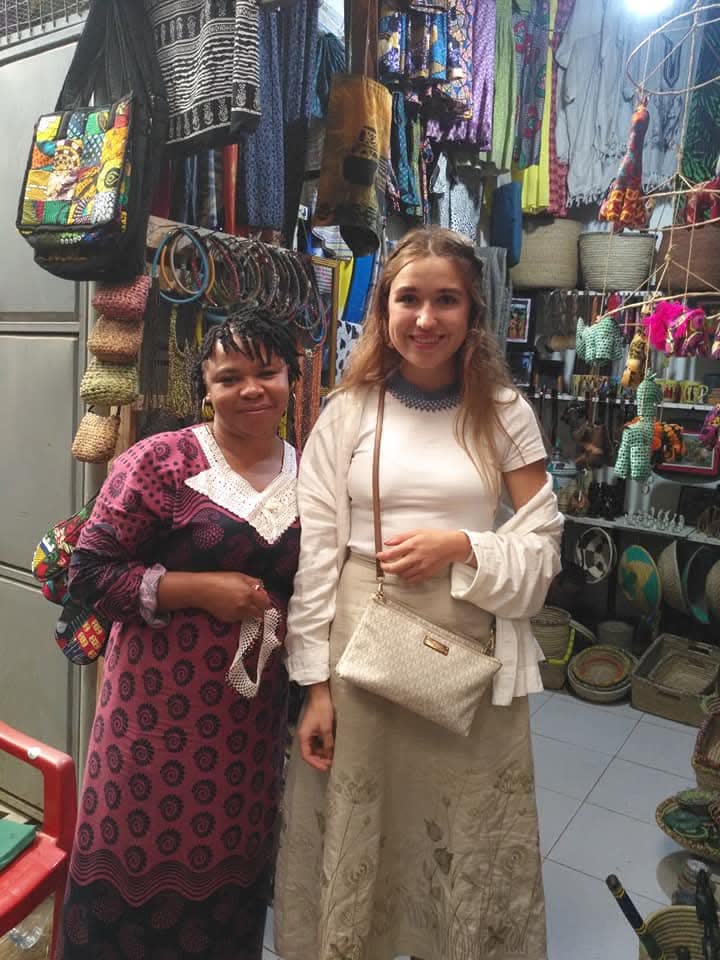 NGULI guests with local artisans in a community market