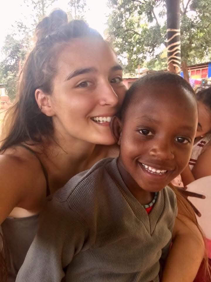 NGULI volunteer with a child in Tanzania