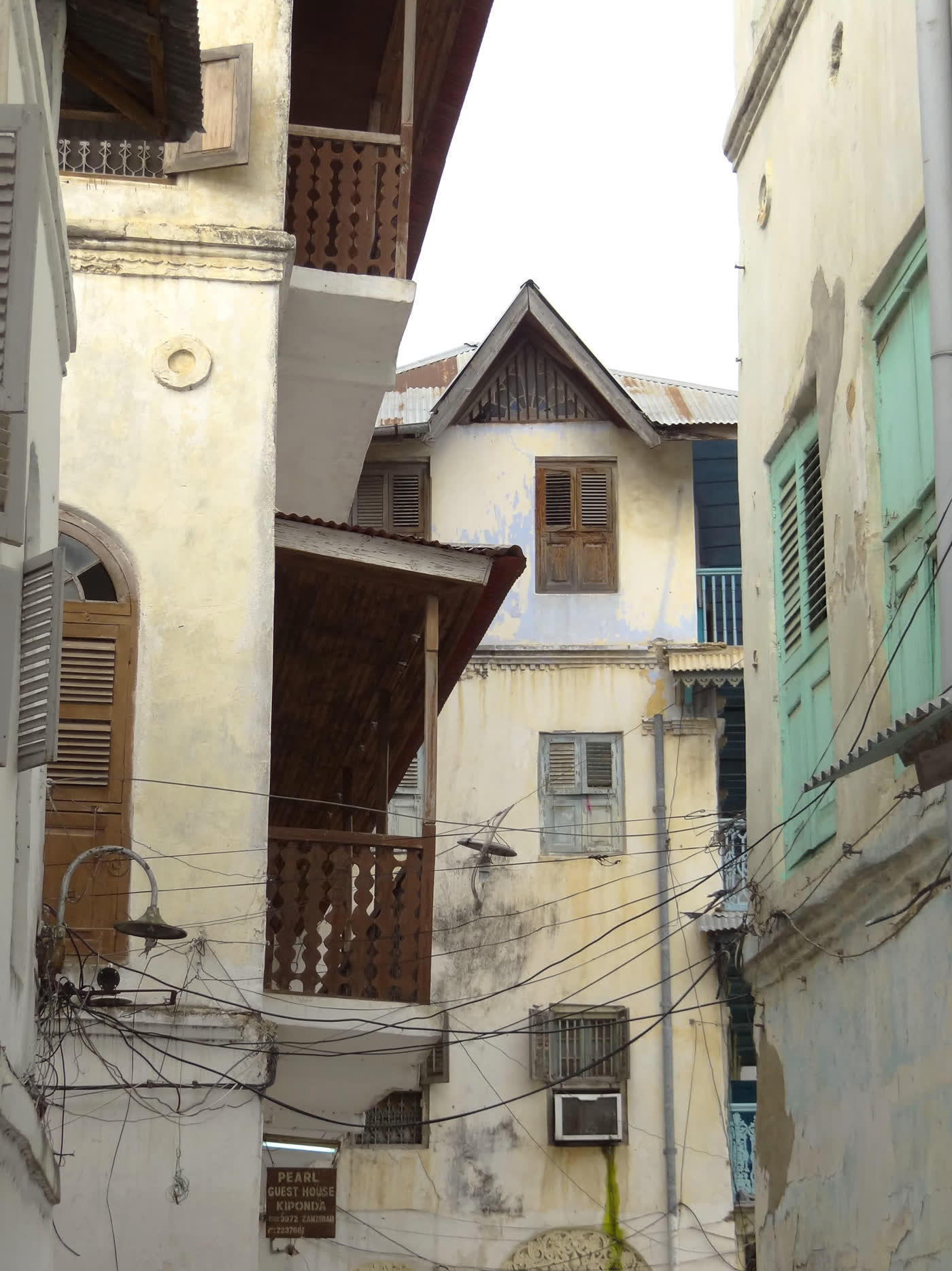 Narrow alley with carved wooden balconies in Stone Town, Zanzibar